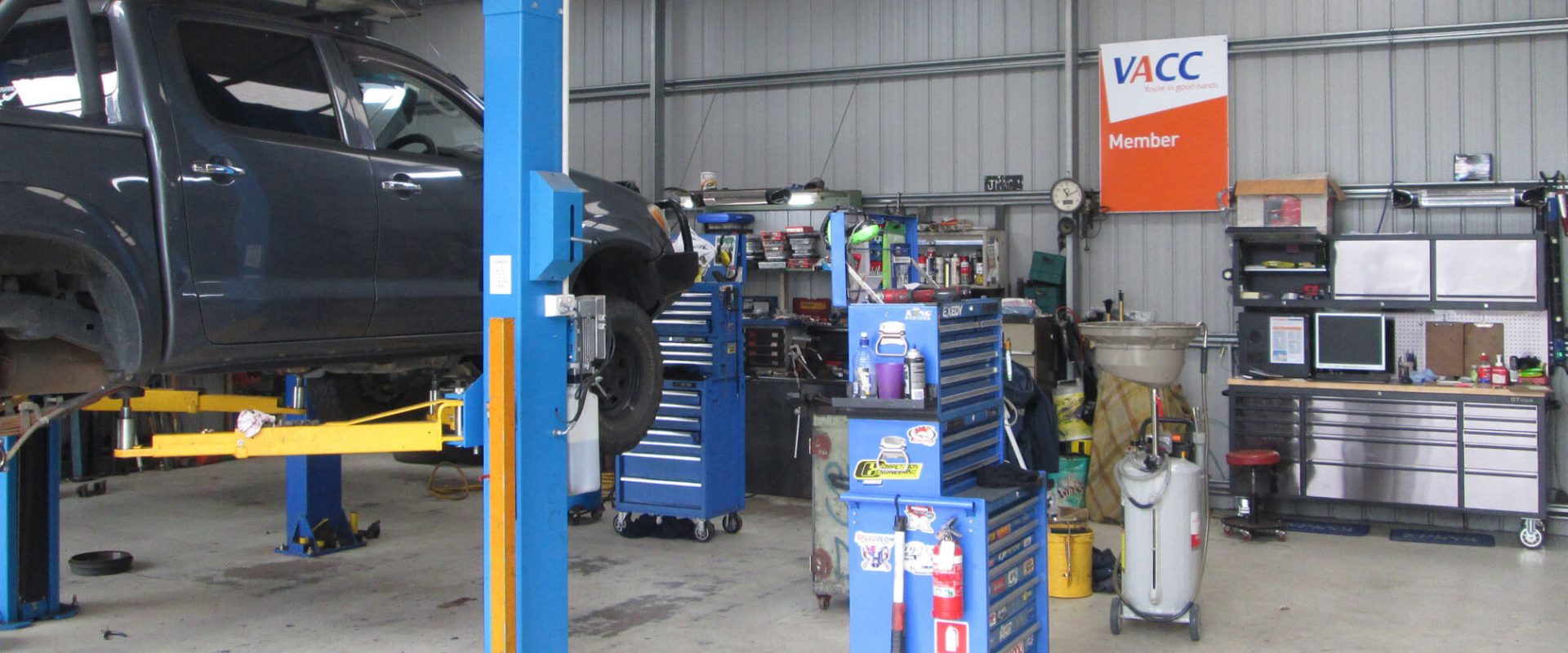 Ute on hoist at JMAC Mechanical